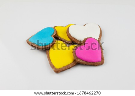 Different colored festive. Pink, white and Yellow heart shaped cookies