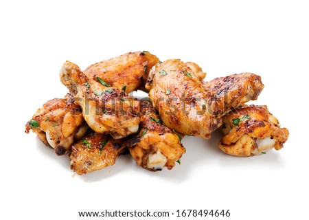 Baked chicken wings isolated on white background Royalty-Free Stock Photo #1678494646