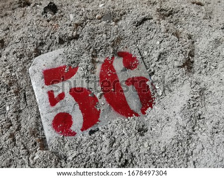 Number 56 in gray ashes