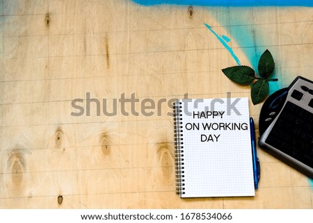 pictured in the photo Cup of coffe and open notebook on wooden background