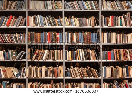 View of shelves with old books in library Royalty-Free Stock Photo #1678536337