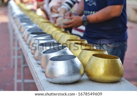 Monk alms bowl for inserting coins to donate money