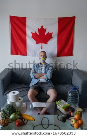 Pandemic and panic. Quarantine. A resident of Canada. A man at home in self-isolation due to coronavirus covid-19. Among food supplies when it is not available in supermarkets.