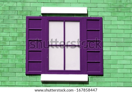 Colorful wooden window on the wall
