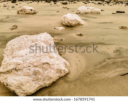 beautiful view of rocks at sandy beach  