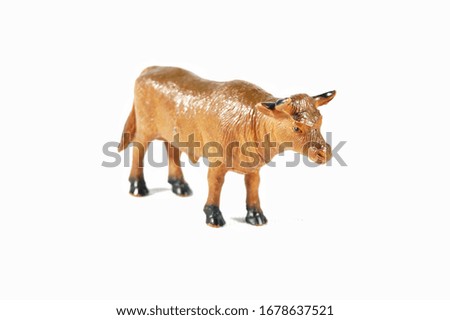 Image of a cow toy isolated on white background 