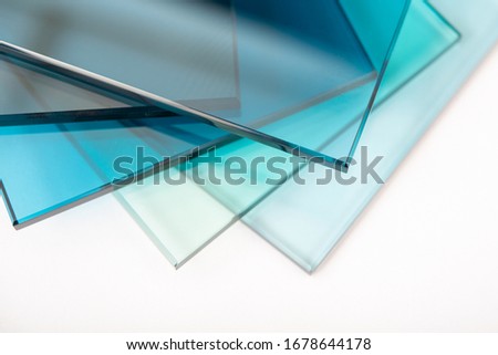 Sheets of Factory manufacturing tempered clear float glass panels cut to size Royalty-Free Stock Photo #1678644178