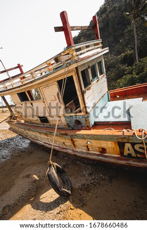 Vertical photography of abandoned boat on the beach, Thailand 