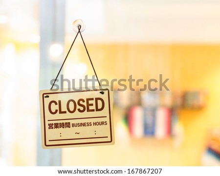 Closed sign at the door of bakery shop