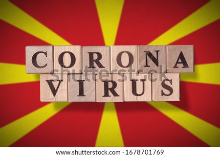 Flag of Macedonia with wooden cubes spelling coronavirus on it. 2019 - 2020 Novel Coronavirus (2019-nCoV) concept, for an outbreak occurs in Macedonia.