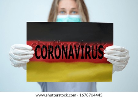 Flag of Germany with outbreak deadly coronavirus covid-19. A large real coronavirus bacteriums against background of the flag of Germany. Concept of coronavirus quarantine. 