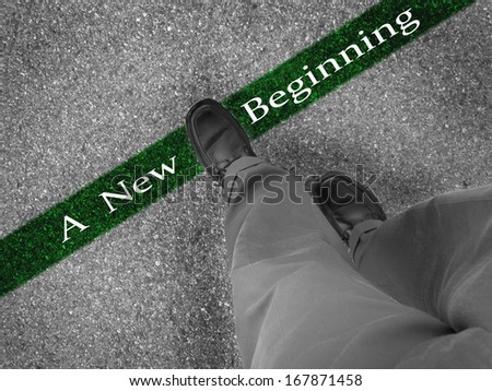 Man walking across a green line with words A New Beginning