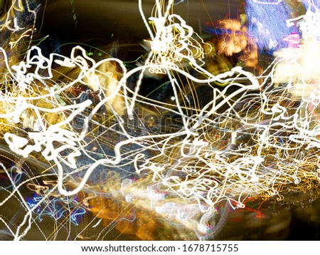 Messy light trails (long exposure, light painting) made with steel wool. To Illustrate power, electricity, energy, sparklers, light.