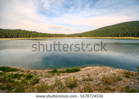 Mountain landscape, lake and mountain range, large panorama.