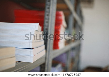 Books on a shelf in the library archive