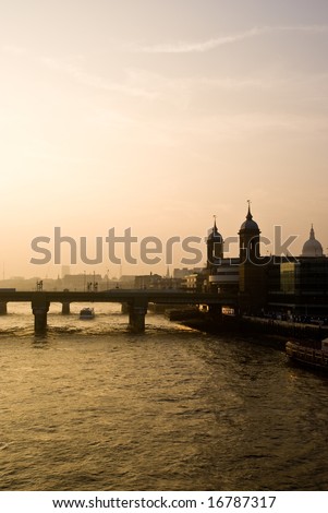 London skyline on the river thames at sunset.