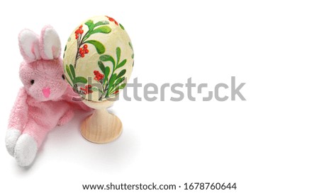 Easter bunny with egg, traditional american easter symbols, close-up, copy space, place for text, isolate, wide banner.