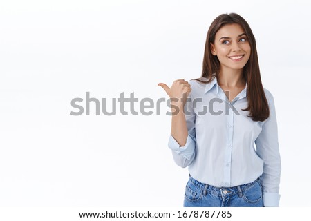 Dreamy and pleased young attractive woman found exactly what need, look and pointing left satisfied with delighted happy smile observe something cool, recommend product, white background Royalty-Free Stock Photo #1678787785