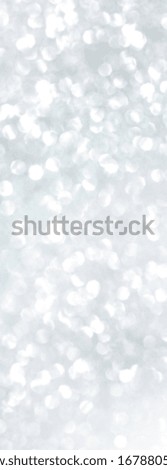 White and grey glitter bokeh circle glow blurred and blur abstract. Glittering shimmer bright luxury. White and silver glisten twinkle for texture wallpaper and background backdrop.

