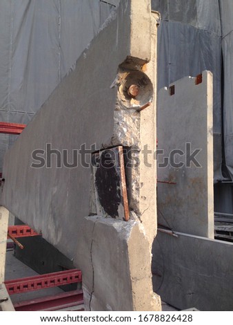 The pop-up damage at steel panel plate of external precast concrete wall panel in the storage area