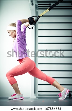 Young woman streching muscles functional training Royalty-Free Stock Photo #167886638