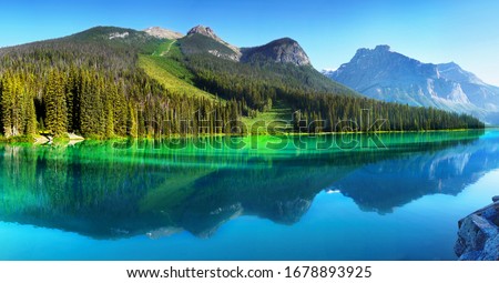 Beautiful colors of Emerald Lake reflection, morning view. Canadian Rockies. British Columbia, Canada Royalty-Free Stock Photo #1678893925