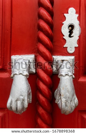 Door knockers in the form of a hand, Algarve, Portugal