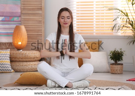 Young woman during self-healing session in therapy room