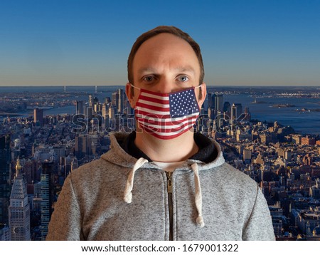 Man with face mask in a shape of American flag in New York.