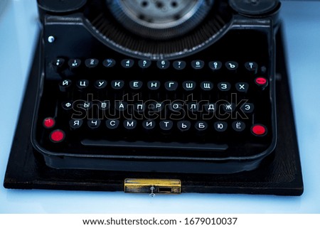 Close up photo of antique typewriter keys, shallow focus.