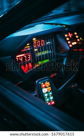 Retro futuristic design concept from 80s of a future car interior with colorful lights and various displays