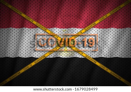 Egypt flag and Covid-19 stamp with orange quarantine border tape cross. Coronavirus or 2019-nCov virus concept