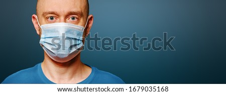 Coronavirus prevention, COVID-19 pandemic protection. Man wearing protective face mask for stop spreading of disease virus. Preventive gear for reducing risk of infection. Banner panorama copy space.