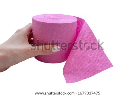 Toilet roll in hand isolated on a white background. Hygiene concept. Essential goods. Coronovirus epidemic.