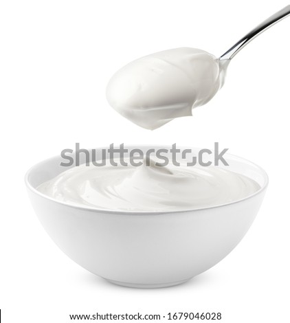 sour cream in bowl and spoon, mayonnaise, yogurt, isolated on white background, clipping path, full depth of field Royalty-Free Stock Photo #1679046028