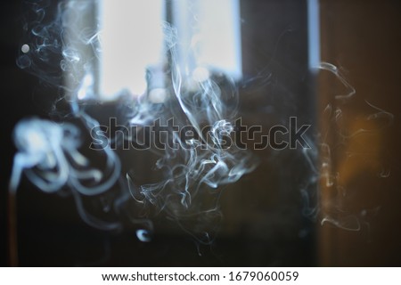 Smoke texture. Smoke. White smoke on a dark background. Beautiful smoke texture.