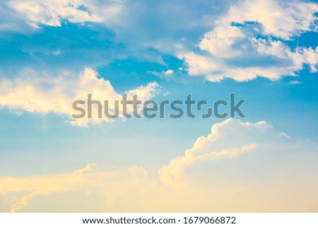 Blurred blue sky and white cloud and golden sunshine background for creative graphic design wallpaper 