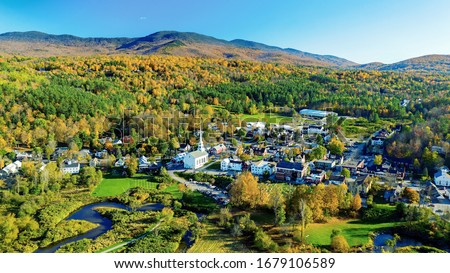Fall colors in the village of Stowe Vermont Royalty-Free Stock Photo #1679106589