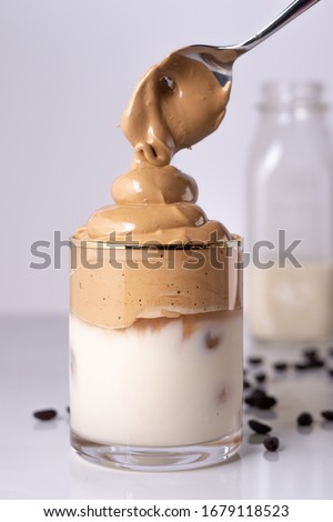 Iced Dalgona Coffee, a trendy fluffy creamy whipped coffee Royalty-Free Stock Photo #1679118523