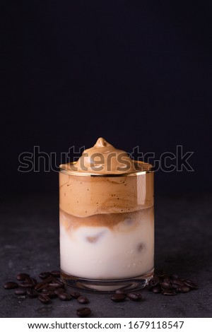 Iced Dalgona Coffee, a trendy fluffy creamy whipped coffee Royalty-Free Stock Photo #1679118547