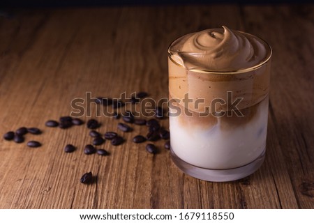 Iced Dalgona Coffee, a trendy fluffy creamy whipped coffee Royalty-Free Stock Photo #1679118550