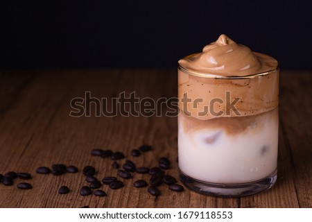 Iced Dalgona Coffee, a trendy fluffy creamy whipped coffee Royalty-Free Stock Photo #1679118553