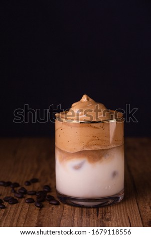 Iced Dalgona Coffee, a trendy fluffy creamy whipped coffee Royalty-Free Stock Photo #1679118556