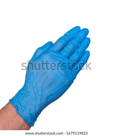 hand of a man in a rubber glove isolated on a white background hand in a medical glove close-up. concept of chiston and hyena. infection prevention