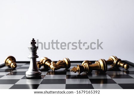 A chess king last stand as a true winner.Money game concept. Copy space. Royalty-Free Stock Photo #1679165392