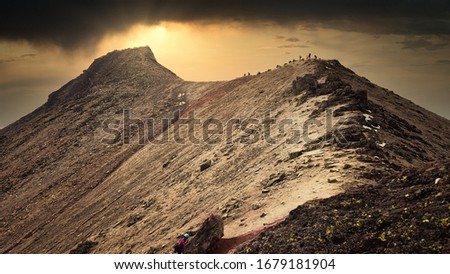 Aerial photography of people walking on the mountain.
It is a sunrise on the Nevado De Toluca volcano in Mexico.
