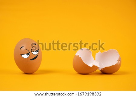 The egg look shows a mocking expression Mock with another broken egg on yellow background.