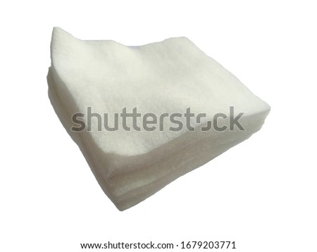 White cotton on white background. Cotton fiber texture background, white fluffy natural material.