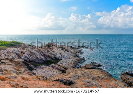 View of sea waves and fantastic rocky coast landscape / Seascape rock tropical island with ocean and blue sky background in Thailand