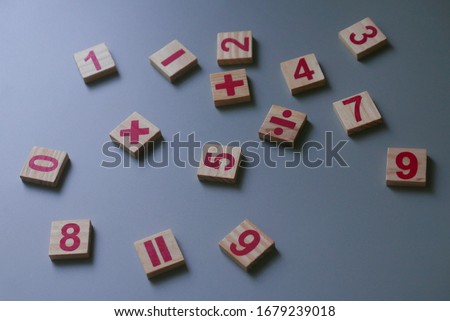 Selective focus of wooden Addition, subtraction, multiplication,division and numbers. They are four basic operations of elementary arithmetic.